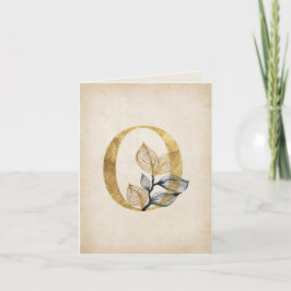 Gold und schwarzes O-Monogramm mit Blättern