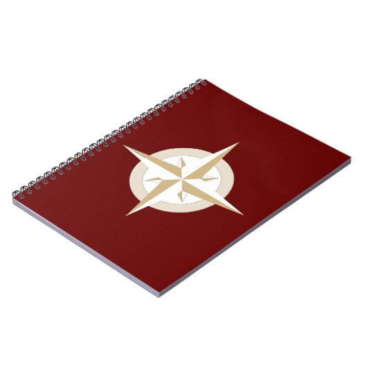 Gold und White Compass auf Red Notizblock (Linke Seite)