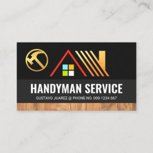 Gold-Zuhause auf grauen Schichten aus Holz Visitenkarte