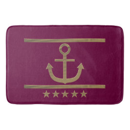 Goldanker auf weinrotem Hintergrund Badematte