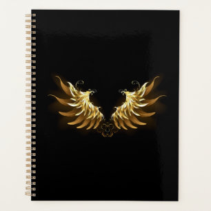 Golden Angel Wings auf schwarzem Hintergrund Planer