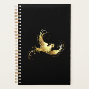 Golden Bird im schwarzen Hintergrund Planer