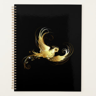 Golden Bird im schwarzen Hintergrund Planer