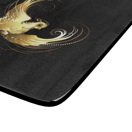 Golden Bird im schwarzen Hintergrund Schneidebrett (Ecke)