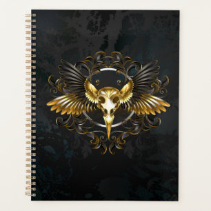 Golden Bird Skull auf schwarzem Hintergrund Planer