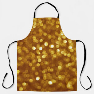 Golden defokussierter Glitzer, funkelnde Textur. Schürze