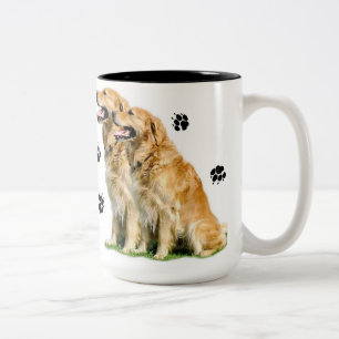 Golden (Retriever) verlassen Sie Pawprints auf Zweifarbige Tasse
