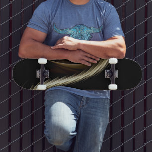 Golden Swish Across Black Skateboard