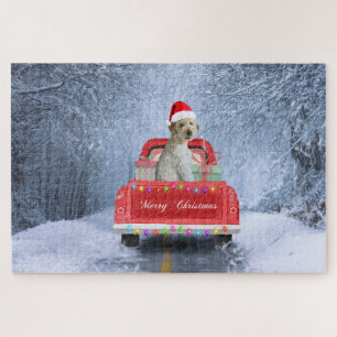 Goldendoodle-Hund im Schnee sitzt in Weihnachten Puzzle