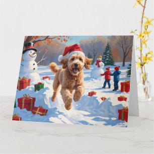 Goldendoodle läuft im Schnee mit Weihnachtshut Karte