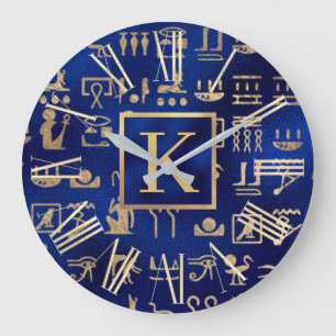 Goldene ägyptische Hieroglyphen auf blauem Anfangs Große Wanduhr