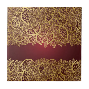 Goldene Blatspitze auf rotem Hintergrund Fliese