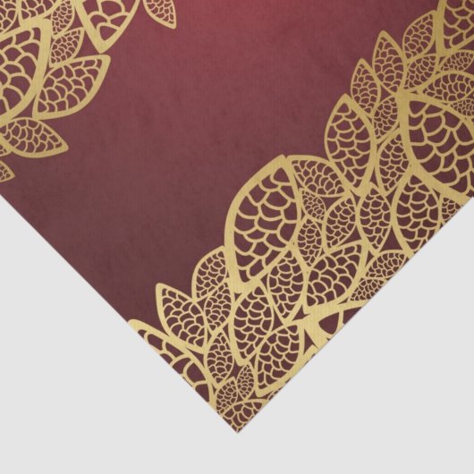 Goldene Blatspitze auf rotem Hintergrund Seidenpapier (Ausschnitt)