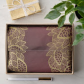 Goldene Blatspitze auf rotem Hintergrund Seidenpapier (Geschenk)