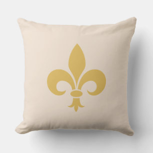 Goldene Fleur de Lis auf hellbeigem Champagner Kissen