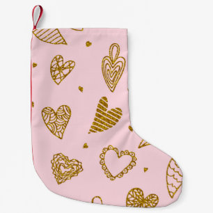 Goldene Glitzer-Herzen: rosa Hintergrundmuster Kleiner Weihnachtsstrumpf
