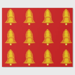 Goldene Glocken auf rotem Geschenkpapier
