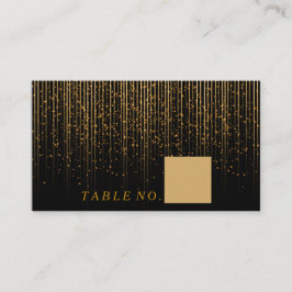 Goldene Lichtdusche auf schwarzen Platzkarten