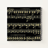 Goldene Musik auf schwarz Notizblock (Rückseite)