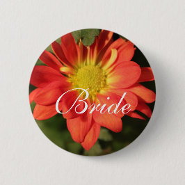 Goldene, orangefarbene Blume. Button