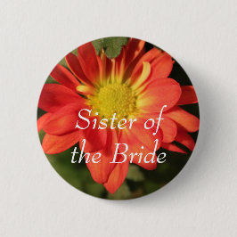 Goldene, orangefarbene Blume. Button