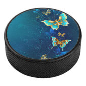 Goldene Schmetterlinge auf blauem Hintergrund Eishockey Puck (3/4)