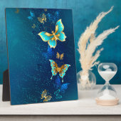 Goldene Schmetterlinge auf blauem Hintergrund Fotoplatte (Seite)