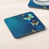 Goldene Schmetterlinge auf blauem Hintergrund Getränkeuntersetzer (Linke Seite)
