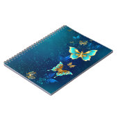 Goldene Schmetterlinge auf blauem Hintergrund Notizblock (Linke Seite)