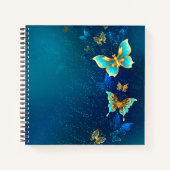 Goldene Schmetterlinge auf blauem Hintergrund Notizblock (Vorderseite)