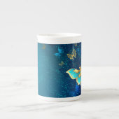 Goldene Schmetterlinge auf blauem Hintergrund Porzellantasse (Vorderseite)