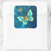 Goldene Schmetterlinge auf blauem Hintergrund Quadratischer Aufkleber (Tasche)