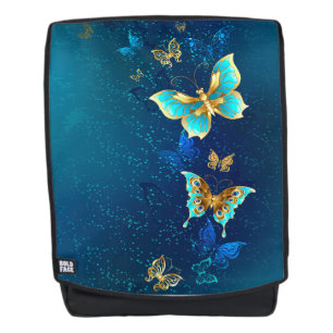 Goldene Schmetterlinge auf blauem Hintergrund Rucksack