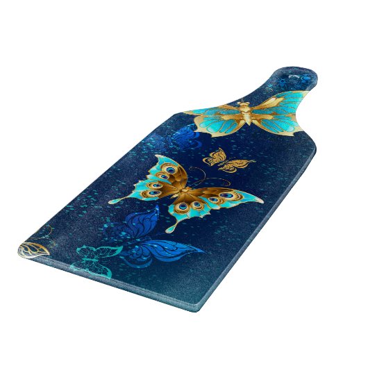 Goldene Schmetterlinge auf blauem Hintergrund Schneidebrett (Ecke)