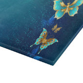 Goldene Schmetterlinge auf blauem Hintergrund Schneidebrett (Ecke)