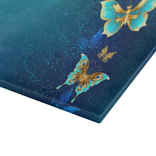 Goldene Schmetterlinge auf blauem Hintergrund Schneidebrett (Ecke)