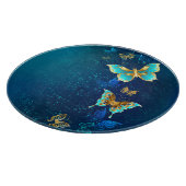 Goldene Schmetterlinge auf blauem Hintergrund Schneidebrett (Ecke)