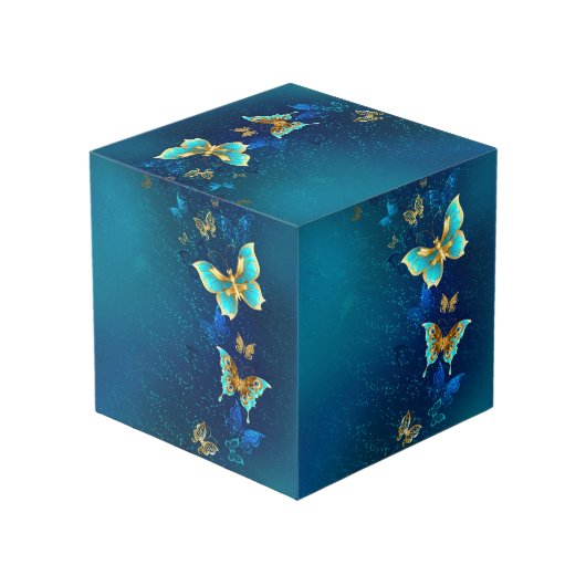 Goldene Schmetterlinge auf blauem Hintergrund Würfel (Rückseite Schrägansicht)