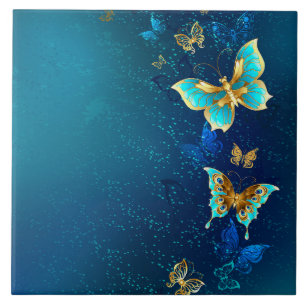 Goldene Schmetterlinge auf einem blauen Hintergrun Fliese