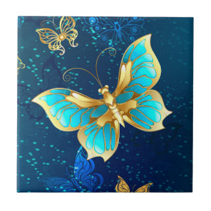Goldene Schmetterlinge auf einem blauen Hintergrun Fliese