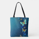 Goldene Schmetterlinge auf einem blauen Hintergrun Tasche (Rückseite)