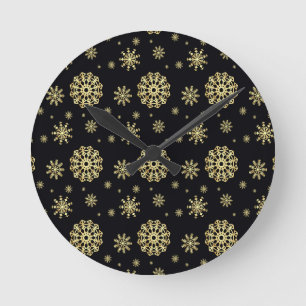 Goldene Schneeflocke auf schwarzem Hintergrund Runde Wanduhr