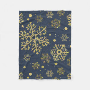 Goldene Schneeflocken auf der Marine Fleecedecke