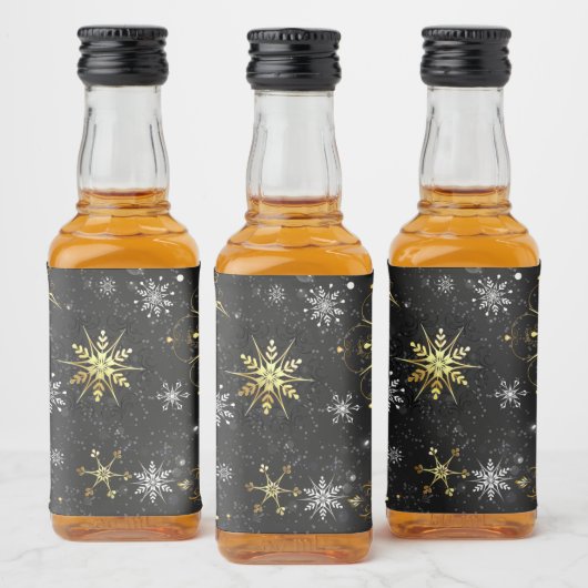Goldene Schneeflocken auf schwarzem Hintergrund Alkoholflaschenetikett (Flaschen)