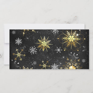 Goldene Schneeflocken auf schwarzem Hintergrund Karte