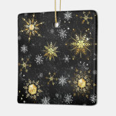 Goldene Schneeflocken auf schwarzem Hintergrund Keramikornament (Links)