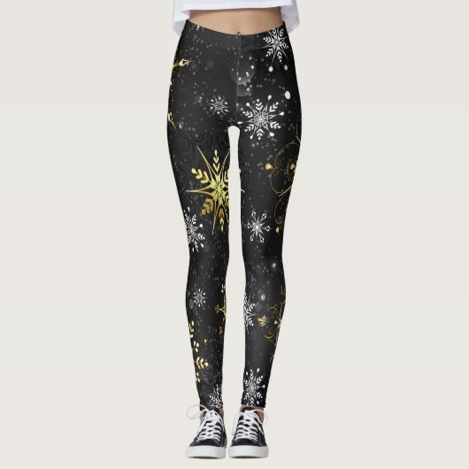 Goldene Schneeflocken auf schwarzem Hintergrund Leggings (Vorderseite)