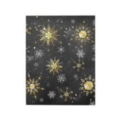 Goldene Schneeflocken auf schwarzem Hintergrund Notizblock (Rotiert)