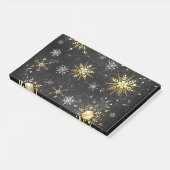 Goldene Schneeflocken auf schwarzem Hintergrund Post-it Klebezettel (angewinkelt)