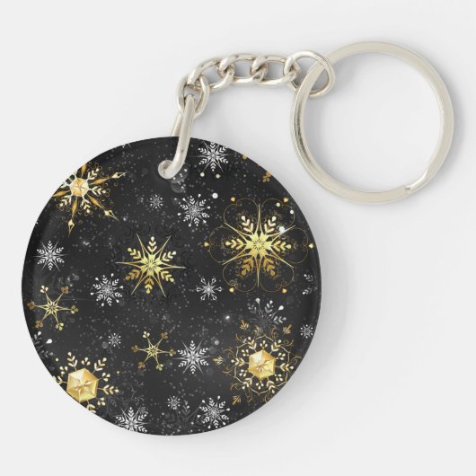 Goldene Schneeflocken auf schwarzem Hintergrund Schlüsselanhänger (Rückseite)